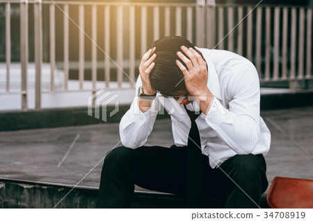 Asian young businessman stress sitting Asian young businessman stress sitting 34708919