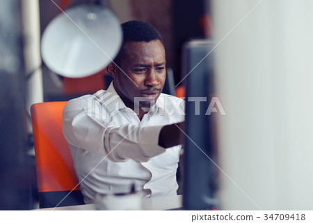 Disappointed African businessman is dazed and 34709418
