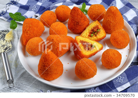 saffron rice cone stuffed with meat saffron rice cone stuffed with meat 34709570