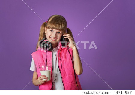 Girl teenager loves to listen to songs 34711957
