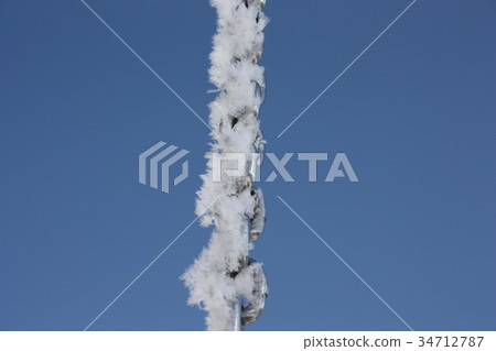 chain in the snow on a blue background 34712787