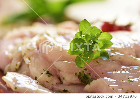 spiced raw slices of chicken breast spiced raw slices of chicken breast 34712976