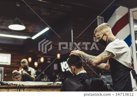 Barber shaving man in chair Barber shaving man in chair 34713612