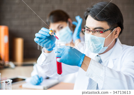 scientist working at the laboratory scientist working at the laboratory 34713613