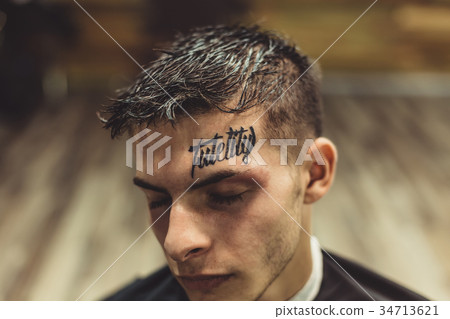 Portrait of man with tattoo 34713621