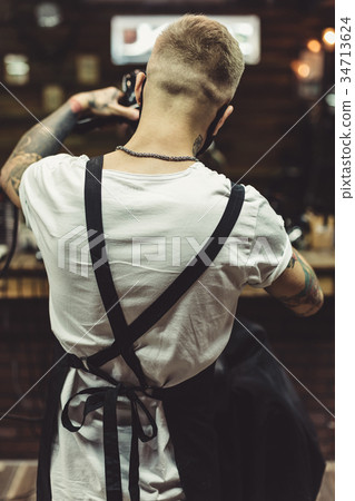 Anonymous barber in process of work Anonymous barber in process of work 34713624