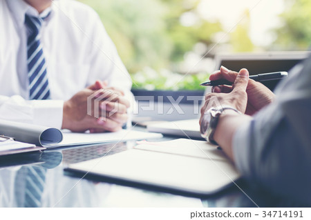 Businessmen and their customer are negotiating 34714191