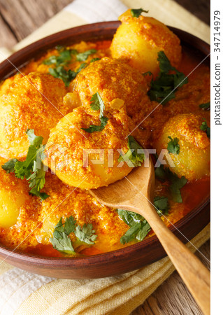 Indian fried potatoes Dum aloo in curry sauce Indian fried potatoes Dum aloo in curry sauce 34714979