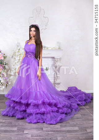 Portrait of a beautiful woman in dress 34715158