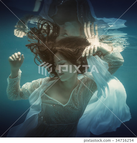 Girl in white dress underwater Girl in white dress underwater 34716254