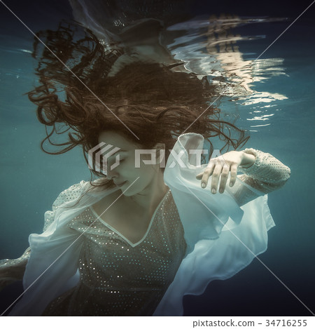 Girl in white dress underwater Girl in white dress underwater 34716255