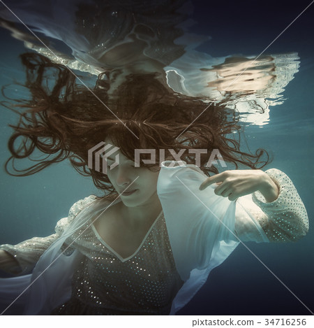 Girl in white dress underwater Girl in white dress underwater 34716256