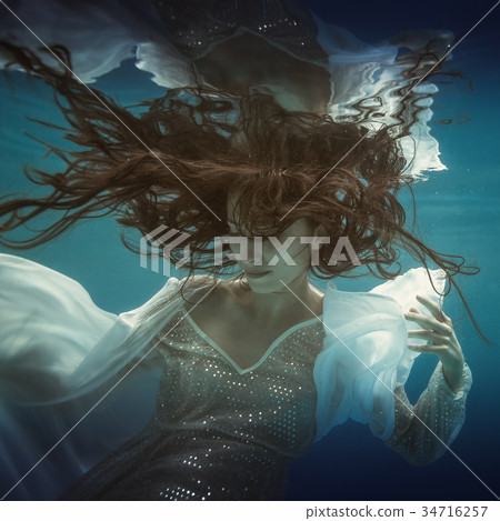Girl in white dress underwater Girl in white dress underwater 34716257