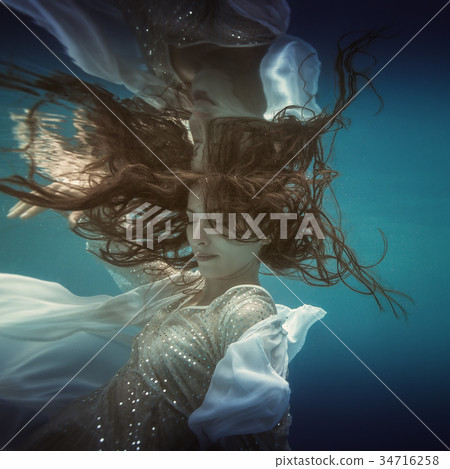 Girl in white dress underwater Girl in white dress underwater 34716258