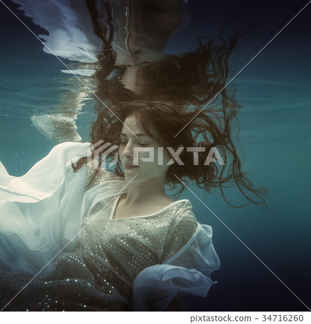 Girl in white dress underwater Girl in white dress underwater 34716260