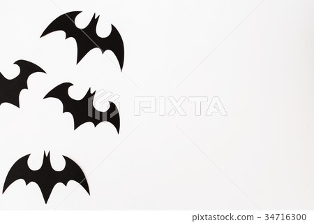 Halloween concept of paper black bats on white 34716300