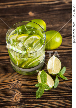 Mojito cocktail on dark background Mojito cocktail on dark background 34716355