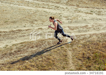 Running sport. Man runner sprinting outdoor in 34718191