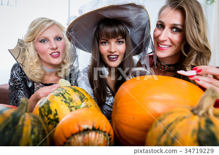 Best friends sharing candies while celebrating 34719229