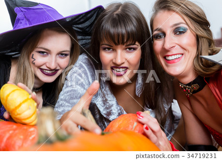 Three beautiful women acting as witches joining 34719231