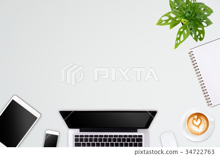 Modern workspace with laptop tablet, smartphone Modern workspace with laptop tablet, smartphone 34722763