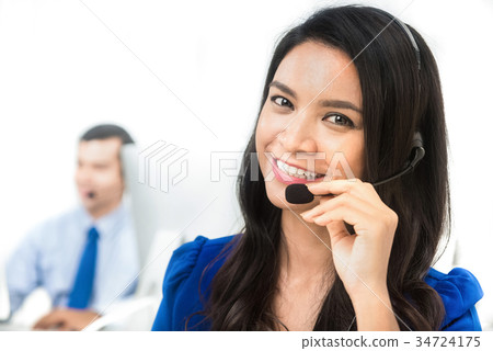 Smiling Asian operator in call center 34724175