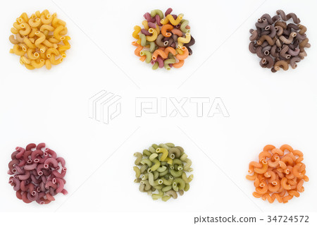Colorful circles of Pasta on white food background 34724572