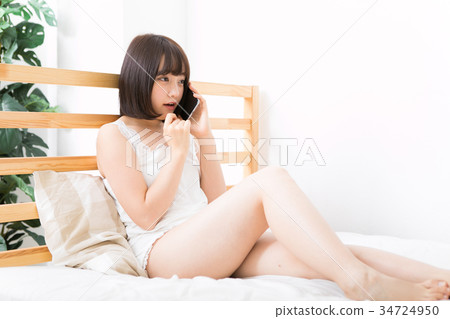 Woman making phone call with smartphone 34724950