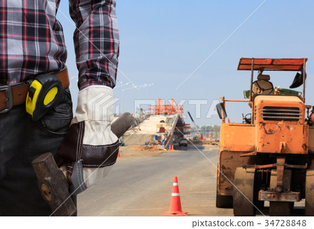 Workers are working on road construction. 34728848