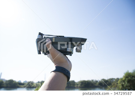 Small drone placed on the hand Small drone placed on the hand 34729587