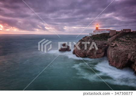 At night the lighthouse shines the road to the sea 34730077