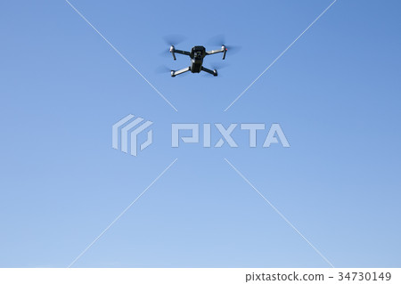 Drone flying in the sky Drone flying in the sky 34730149