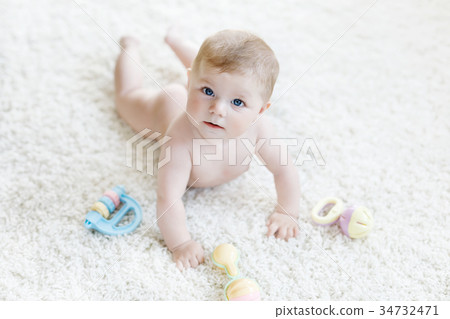 Cute baby girl playing with colorful pastel 34732471