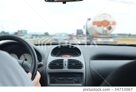 Man driving in a traffic jam 34733067