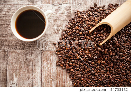 Coffee cup on coffee beans Coffee cup on coffee beans 34733182