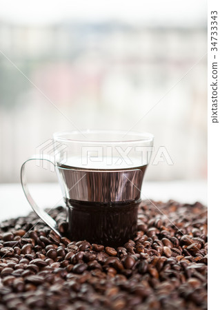 Coffee cup on coffee beans Coffee cup on coffee beans 34733343
