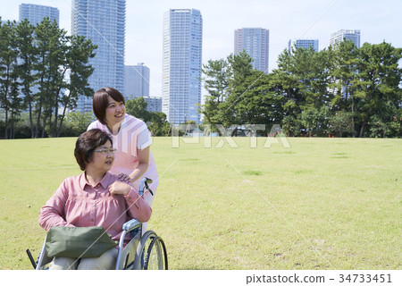 Senior and helper who talks happily Senior and helper who talks happily 34733451