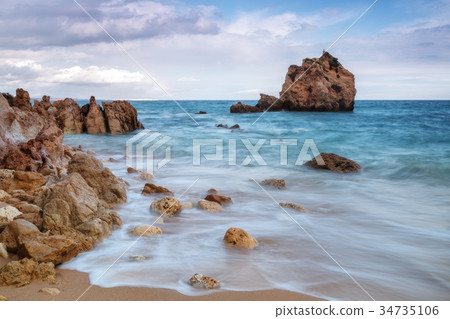 A delightful landscape on a rocky beach Arrifes im 34735106
