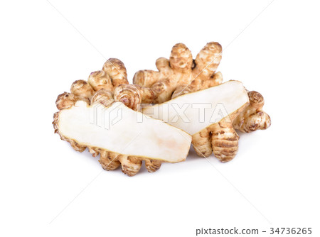 whole and cut fresh Jerusalem Artichoke on white 34736265
