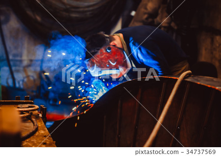 Metal Welding with sparks and smoke Metal Welding with sparks and smoke 34737569