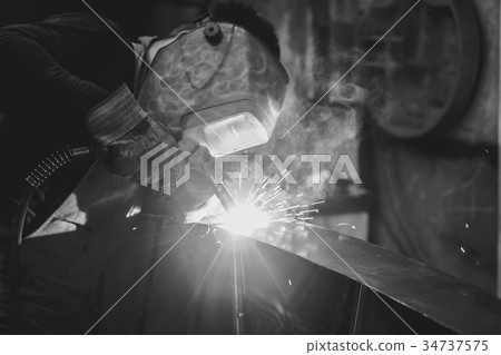 Metal Welding with sparks and smoke Metal Welding with sparks and smoke 34737575