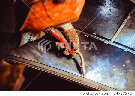 Metal Welding with sparks and smoke Metal Welding with sparks and smoke 34737576