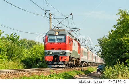Electric locomotive with a passenger train in 34738342
