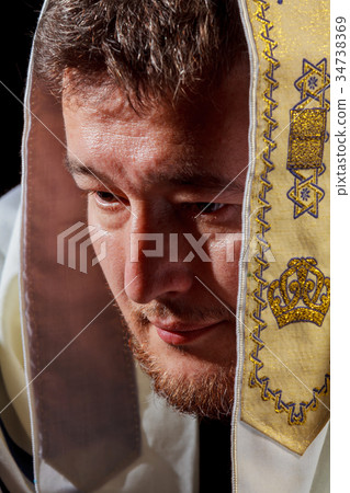 Jewish man in prayer during Jewish holiday Jewish man in prayer during Jewish holiday 34738369