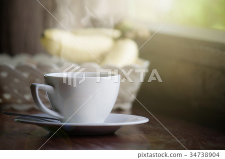 Coffee Cup With Smoke On Soft Light In Morning Coffee Cup With Smoke On Soft Light In Morning 34738904