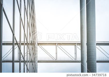 modern glass facade, steel bridge office building 34739718