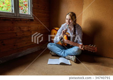 girl with a guitar who writes a song 34740791