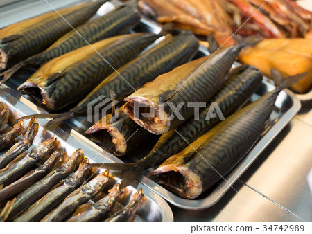 Smoked mackerel and other fish in food store 34742989