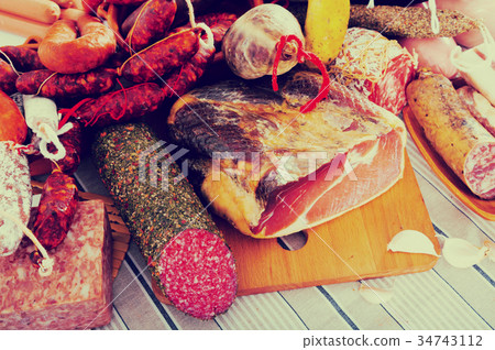 Variety of meats on table Variety of meats on table 34743112
