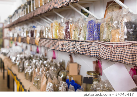 Glass cans with many different dry spices standing Glass cans with many different dry spices standing 34743417